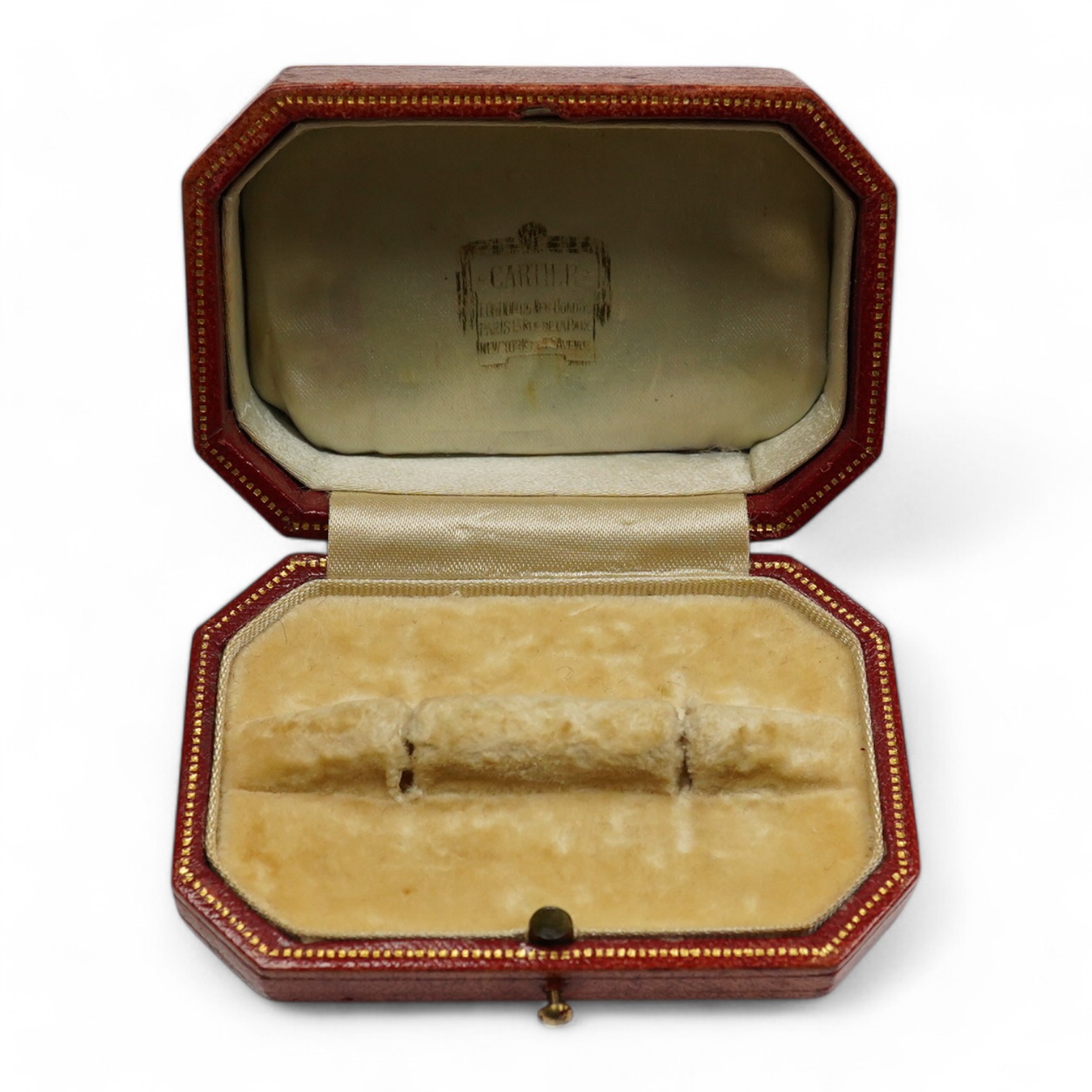 A 1930's/1940's Cartier gilt tooled leather cufflink box, of octagonal form, 83mm by 54mm. Condition - poor to fair